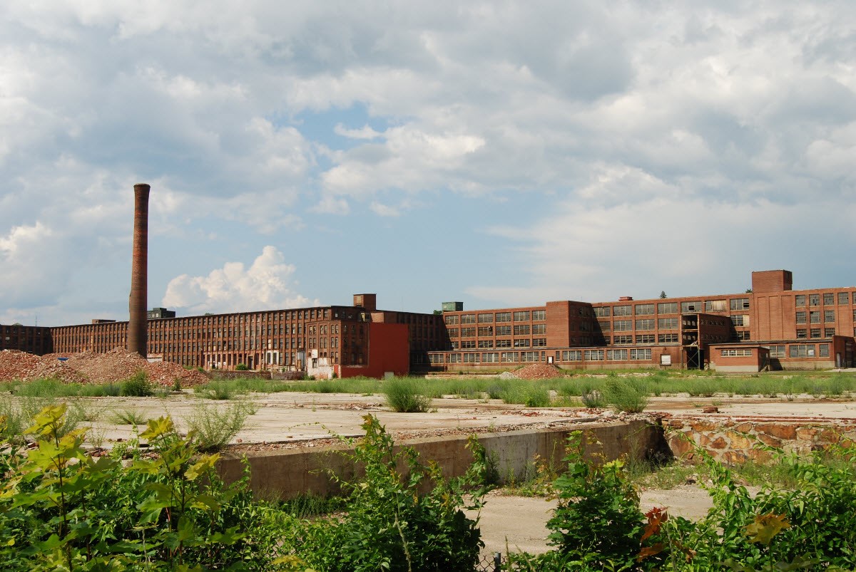 Brick mill stands in the distance