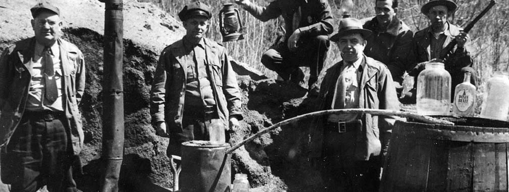 officers at a moonshine still