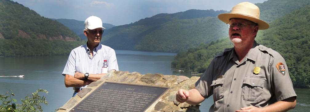 ranger talking by historic marker