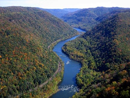 deep forested river gorge with fall colors