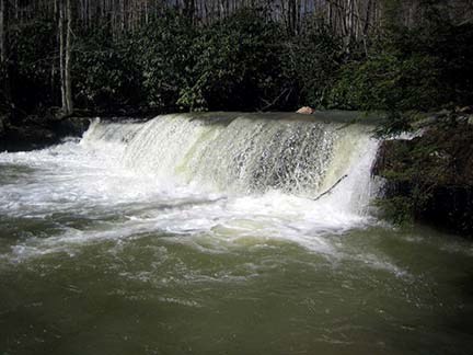 waterfall over rock ledge