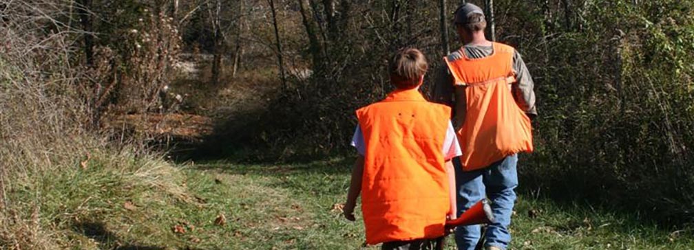 hunters walking down trail