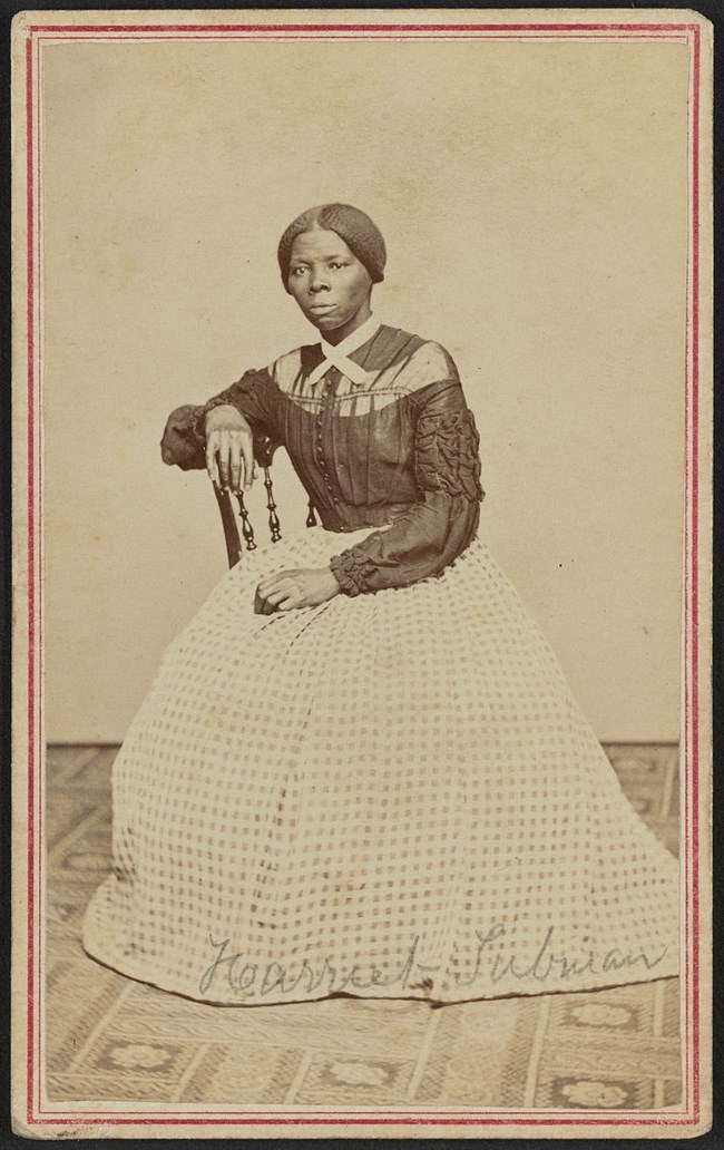Portrait of Harriet Tubman sitting on a chair.
