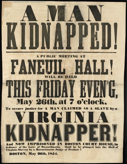 A broadside which is light brown in color with black text in a variety of different fonts. The man part of the page has "A Man Kidnapped!" printed on it and then invites the public to a public meeting at Faneuil Hall to plan how to save Anthony Burns.