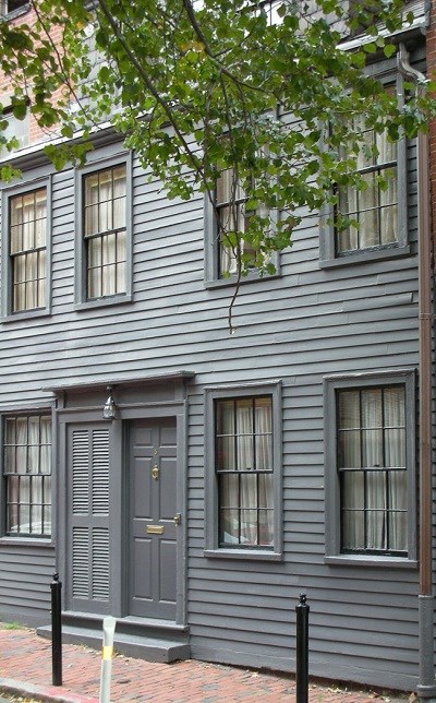 gray painted two story wood house.