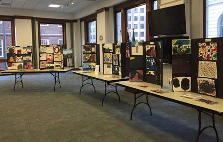 Children's paintings exhibited on tables Children's paintings exhibited on tables