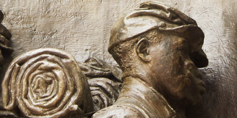 Profile view of an African American soldier from the Shaw Memorial, cast in bronze.