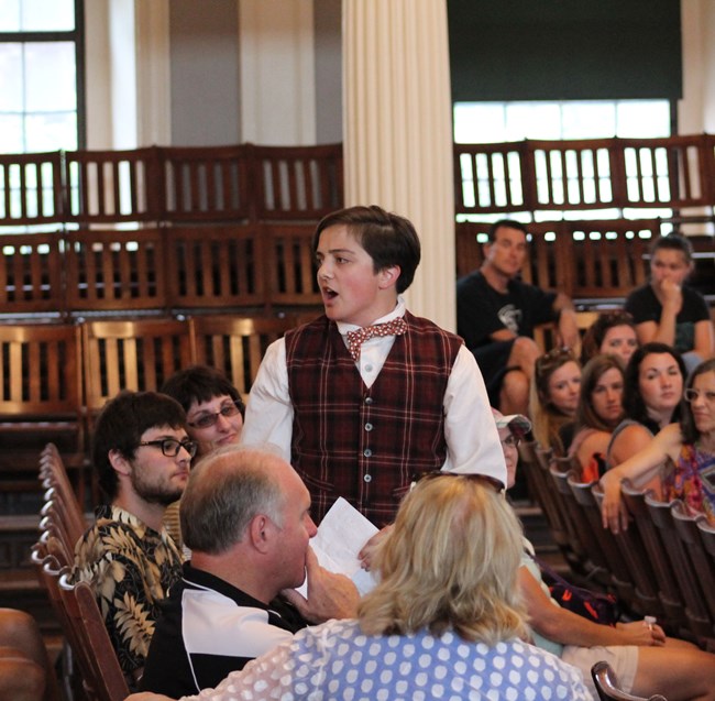 Park Rangers dressed in 19th century clothing participate in the Rocking the Cradle Program.