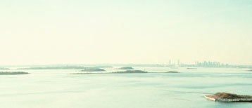 Aerial view of the drumlins of Boston Harbor. The skyline of the City of Boston is visible in the distance. Aerial view of the drumlins of Boston Harbor. The skyline of the City of Boston is visible in the distance.