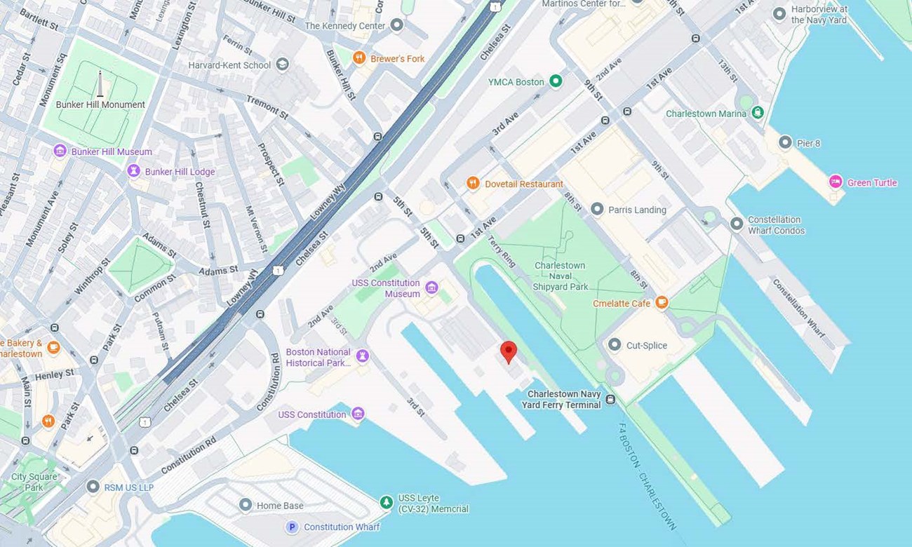 Google Map view of the Charlestown Navy Yard, with a red marker on Building 125 near the end of Pier 2