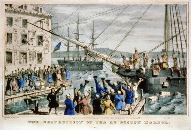 Men dressed as American Indians are on a ship center right throwing chests overboard while colonists on wharves in foreground and on left cheer in support. Another ship in background shows silhouette of more men dumping chests.
