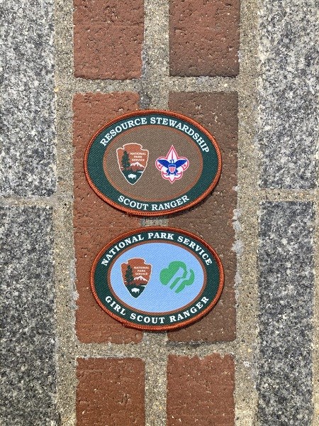 scout ranger patch and girl scout ranger patch on the red brick of the freedom trail
