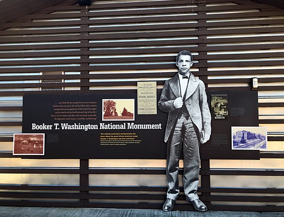 A cutout image of Booker T. Washington in a suit with pictures of the monument and the title Booker T. Washington National monument.