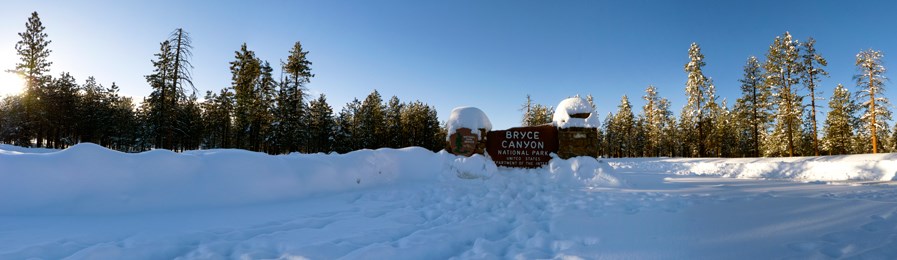 Main entrance sign to Bryce Canyon during winter. Main entrance sign to Bryce Canyon during winter.