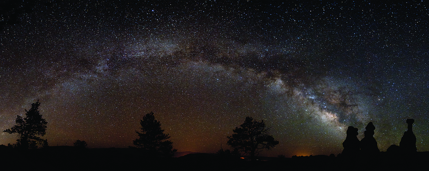 Bryce Canyon stargazing panorama with a bright Milky Way above the amphitheater