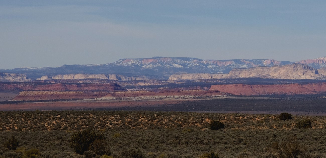 View of colorful cliffs including vermillion, white, and pink