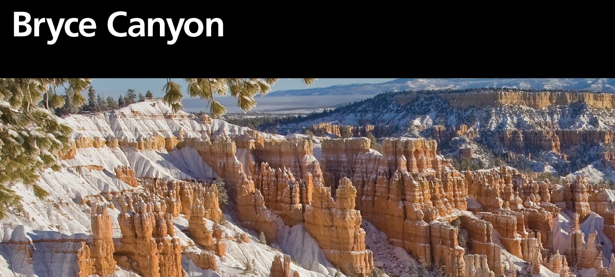 Brochure for Bryce Canyon National Park, black bar. Below a large panoramic landscape photo shows the vertical red rock formations called Hoodoos emerging upwards from a layer of white snow in a bowl shaped landscape.