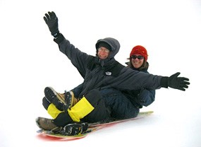 Couple Sledding