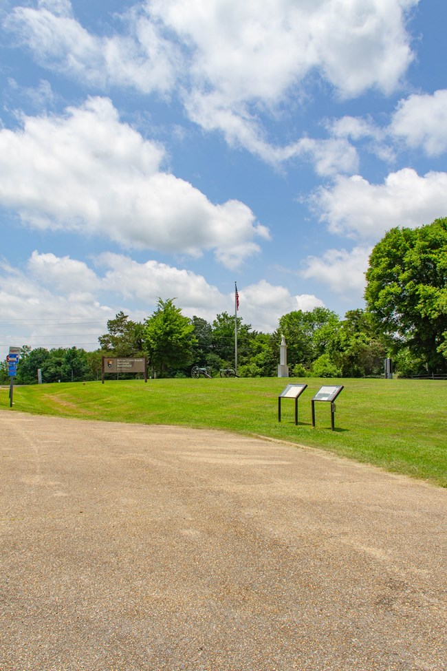 An asphalt parking area at Brices Cross Roads National Battlefield Site.