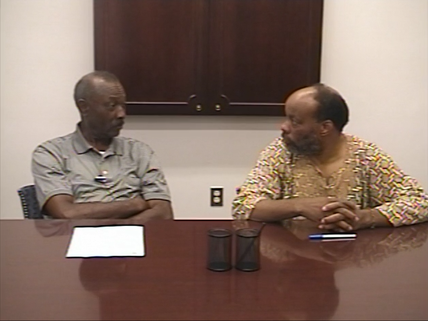 B.O. Butler Sr., left, is interviewed by Oloye Adeyemon, right.