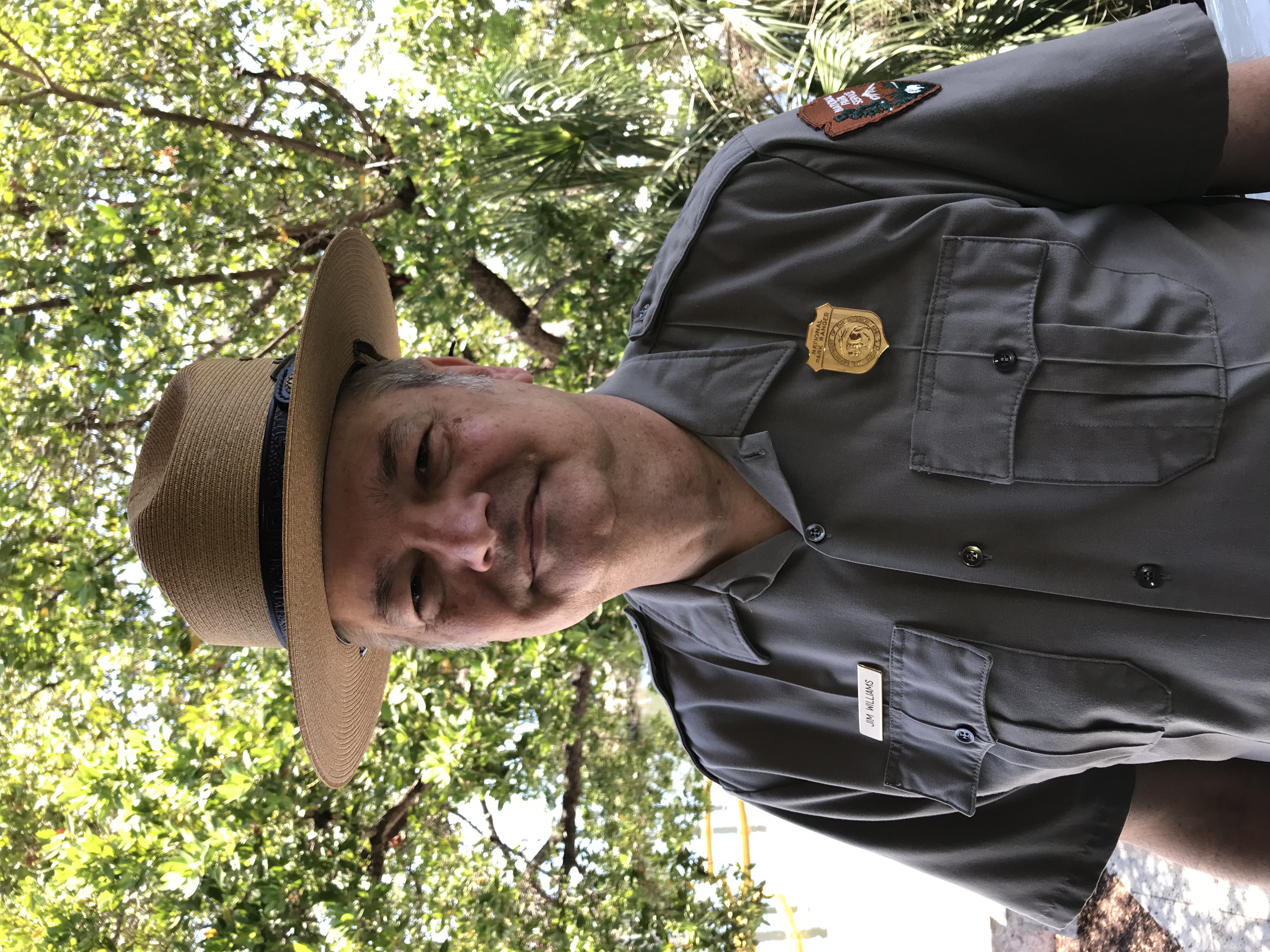 James Williams in Ranger outfit standing in front of a tree