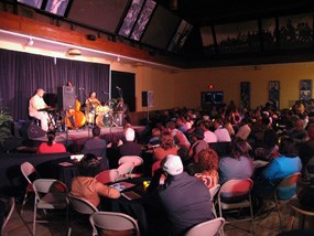 The Jazz Disciples perform for a crowd in the historic "Down Beat" located in the orientation gallery at Brown v. Board of Education National Historic Site.