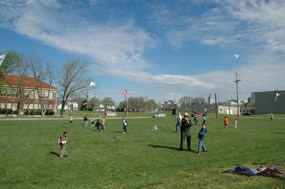Students flying kites on the historic playground.