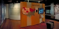 The Five Lawsuits exhibit and timeline wall panels in the Education and Justice gallery.