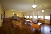 Current photo of Kindergarten Room with small tables and chairs reminiscent of the 1950's.