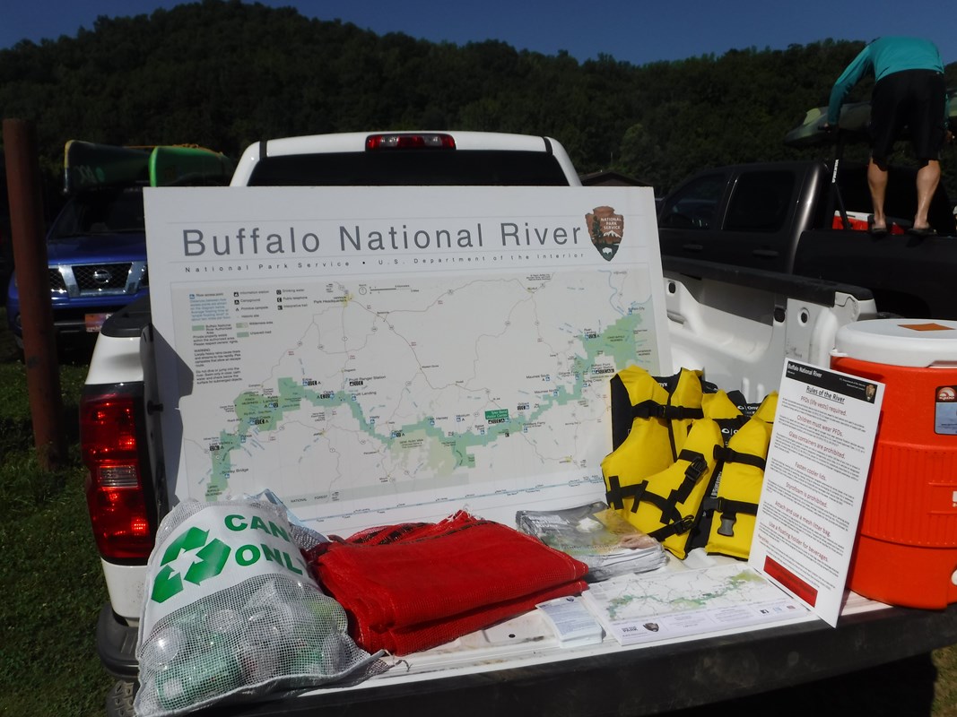 A ranger truck with paddling gear and safety information::Tailgate Talks