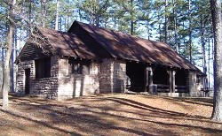 color photo of open sided pavilion with rock pillars