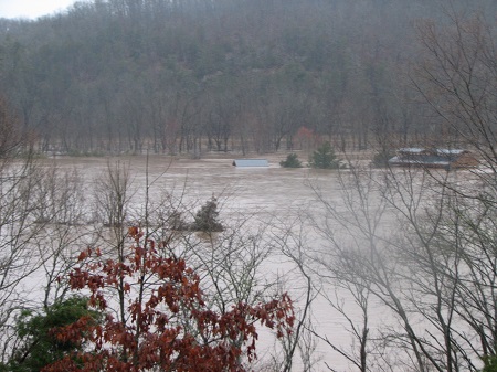 flooding river covering pavilion structure to roofline