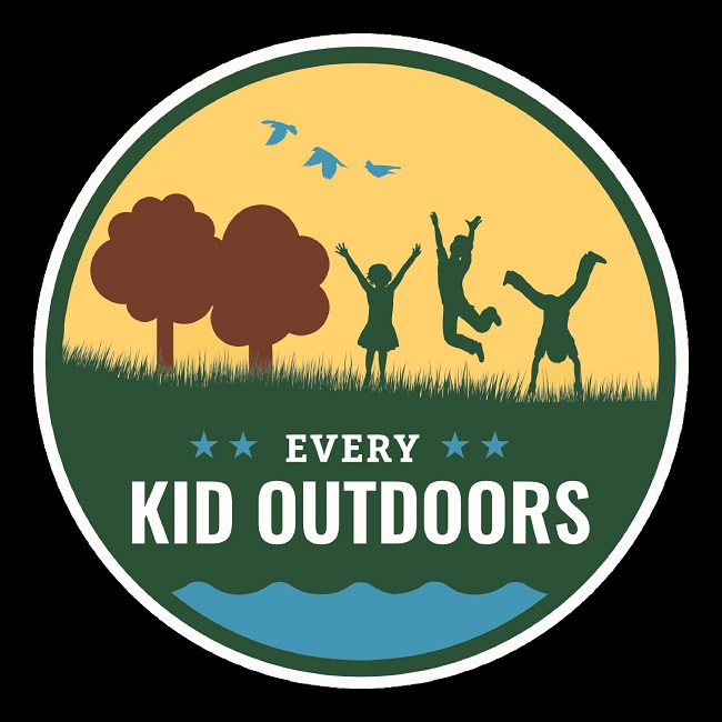 color graphic of white circle with yellow top half with brown tree and green children silhouettes, dark green middle and  blue at bottom with white letters Every Kid Outdoors