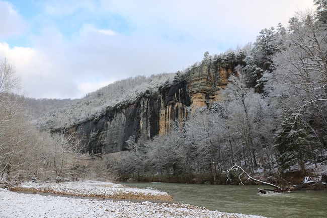 RoarkBluffWinter color photo of snow covered gravel on left, river from bottom right to center, and snow covered trees at right
