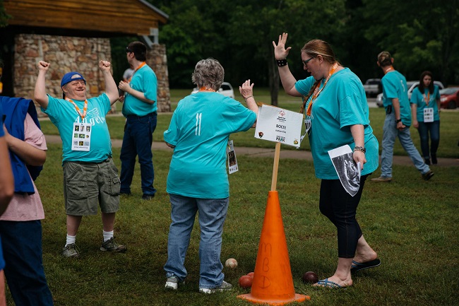 bocce resized color photo of people in blue shirts with orange traffic cone in foreground