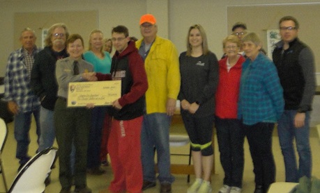 Compton AR Volunteer Fire Department Deputy Superintendent presents grant