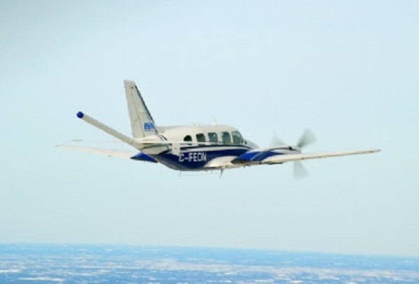 photograph of small plane in blue sky