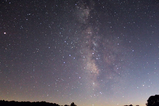 color photo of milky way stars in dark sky