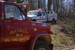 Rea Valley red fire truck at left, white NPS fire vehicle in background at center