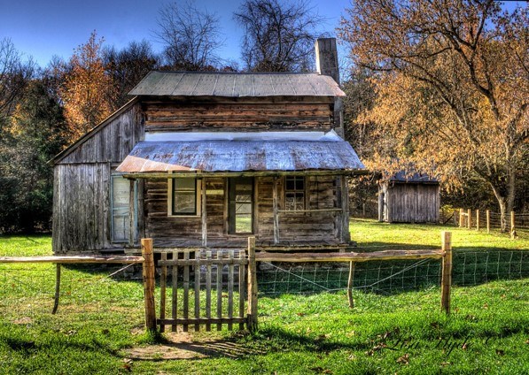 The Parker-Hickman house and wooden fence in the fall