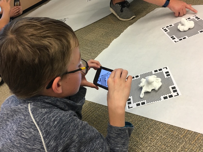 a student uses an iPod to capture images of his model from every angle, the first step in creating a ready-to-print 3D biomodel.