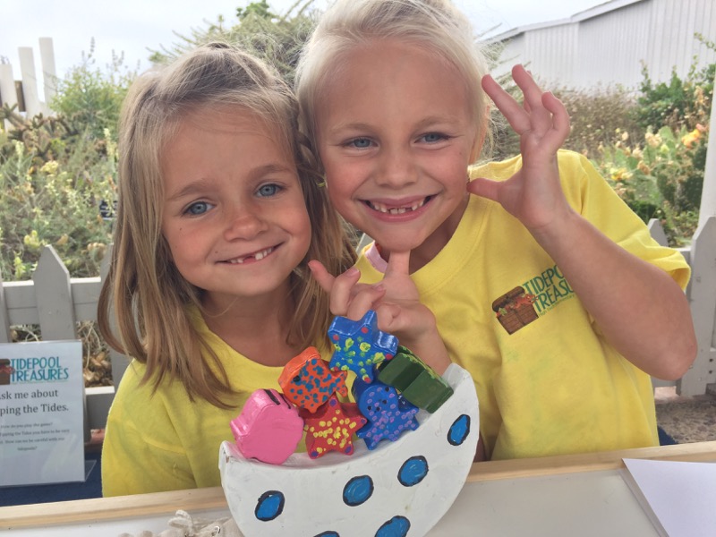 Children showing off their creative tidepool treasures