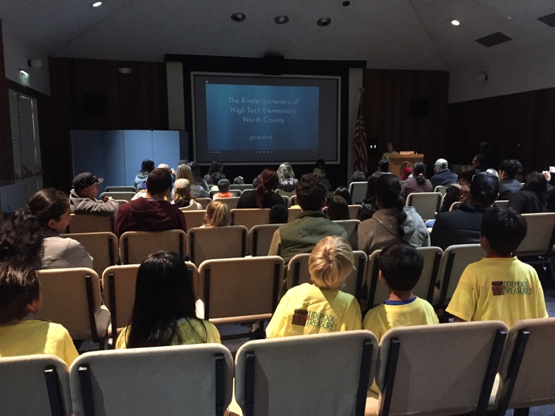 Elementary students participating in auditorium presentation