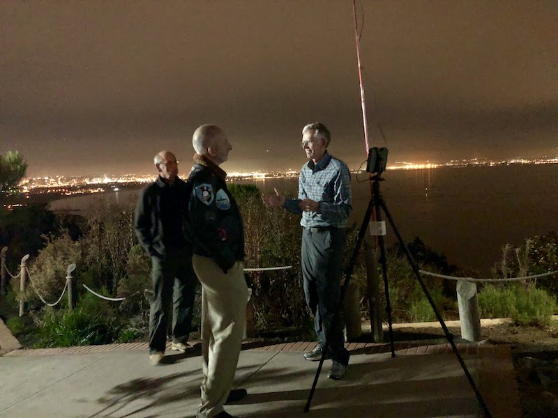 guest speaker Don Endicott displays his bat-recording device and answers questions from guests near the Visitors Center.