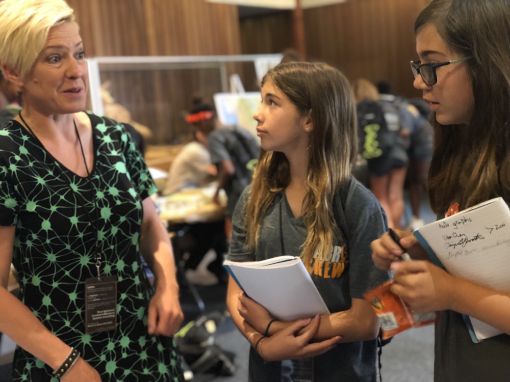 Zed Sevcikova Sehyr, Neuroscientist at SDSU, talks to eager participants about how your brain comprehends words.