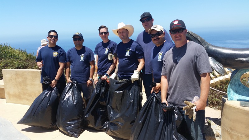 Photo of Navy Crew helping remove weeds