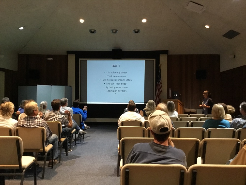 Lecture attendees take the oath to no longer call all insects “bugs” or use the misnomer “lady bug.”