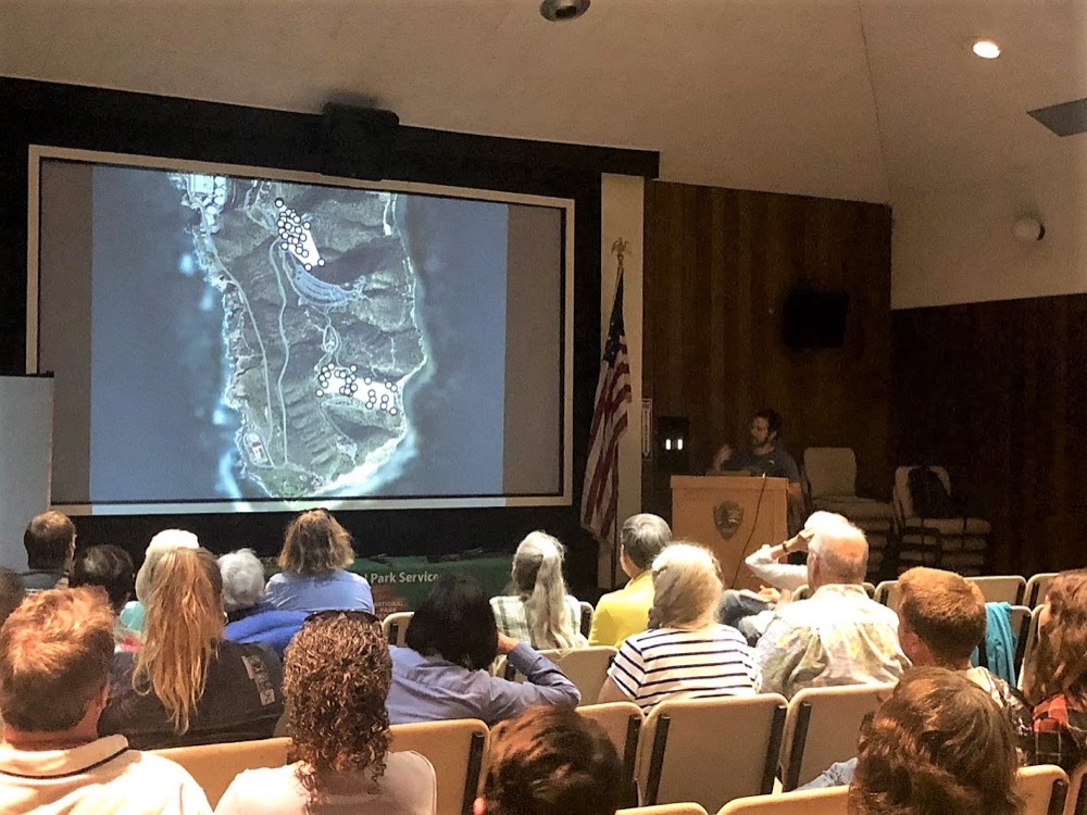 Speaker Roman Nava speaks to lecture attendees on July 19.