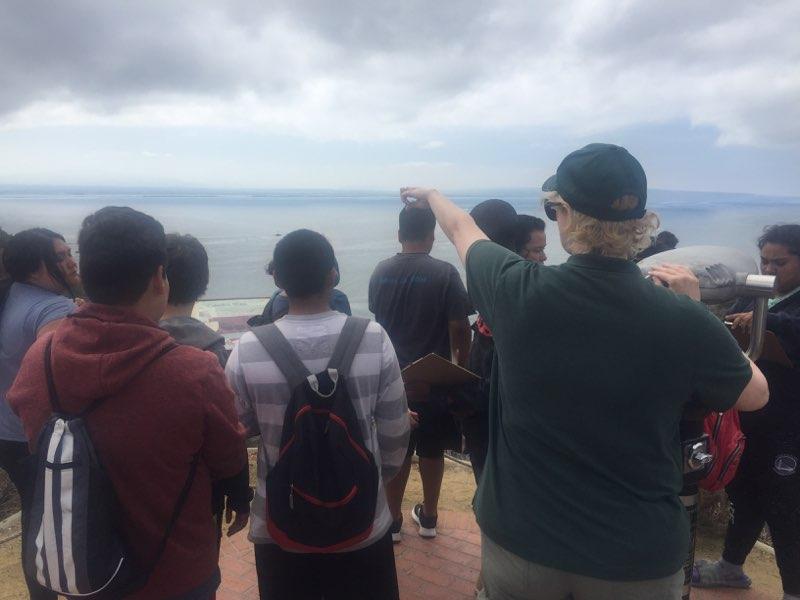 Students from Monarch School observing biodiversity on a nature walk at Cabrillo National Monument