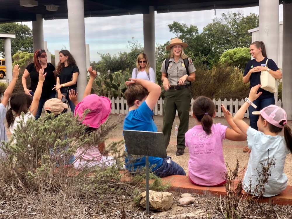 A Park Ranger presenting to a group of fourth-grade students at Cabrillo National Monument. A Park Ranger presenting to a group of fourth-grade students at Cabrillo National Monument.